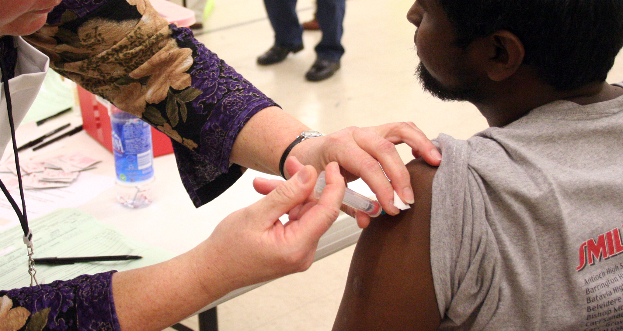 Provider administering a vaccine