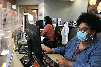 Staff wearing facemasks at the Public Health Clinic