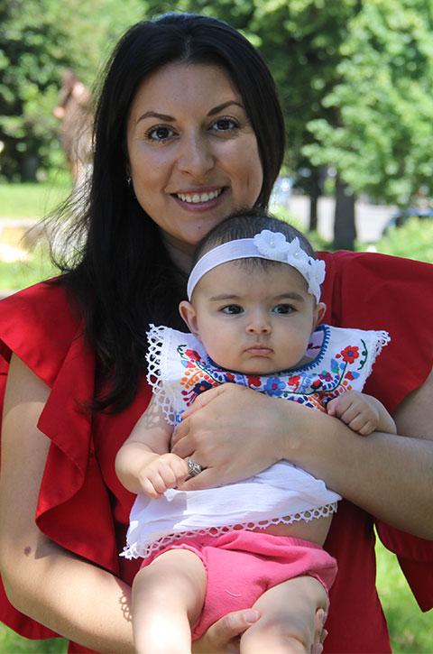 Avra holding her daughter